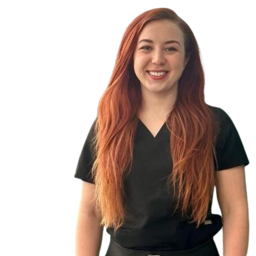 Confident healthcare professional with vibrant red hair smiling